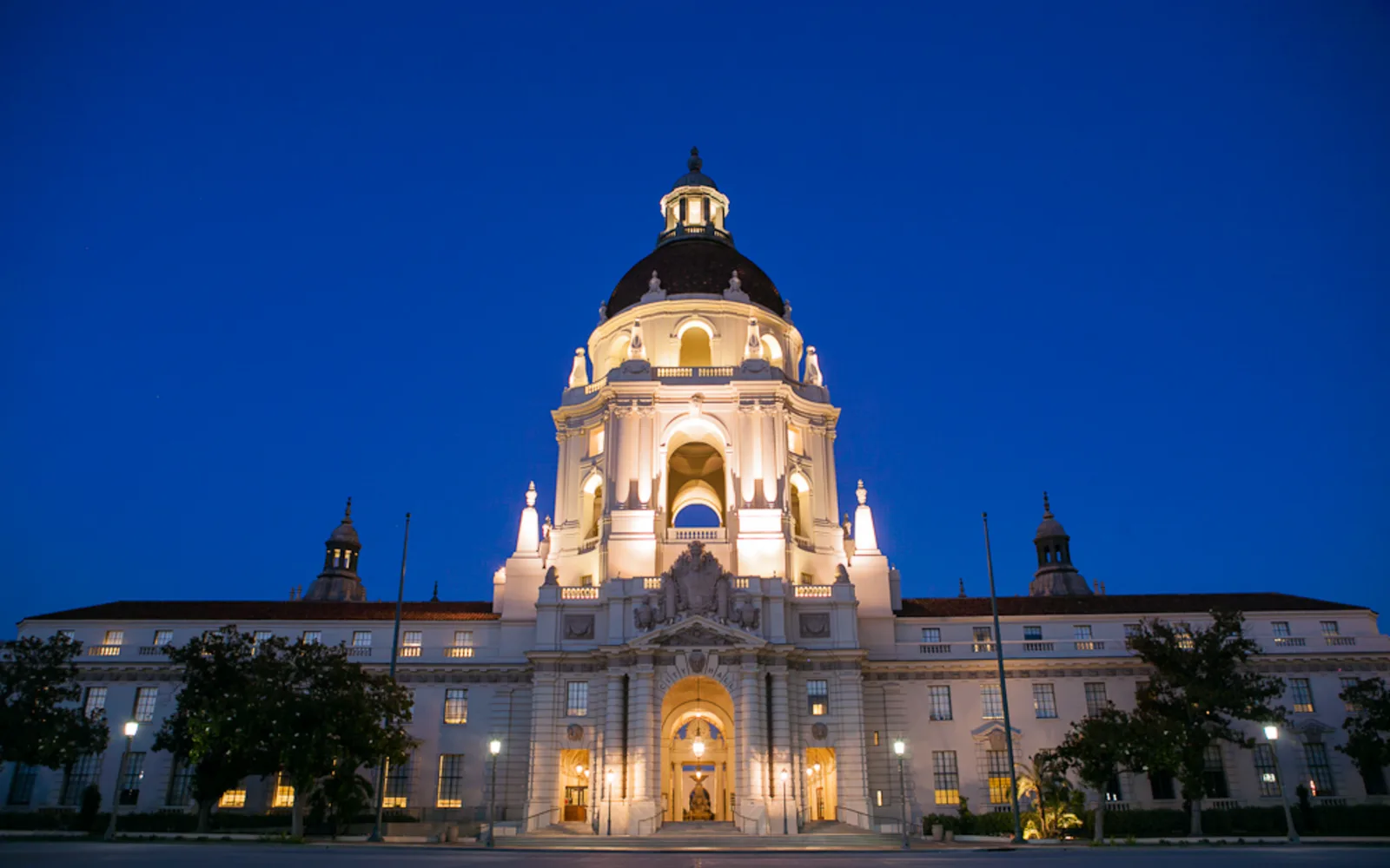 Pasadena City Hall illuminated at dusk, a neighboring Pasadena civic landmark